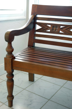 Teak Indonesian Bench, right detail, with carved flowers and turned wood details, San Mateo, California, USA